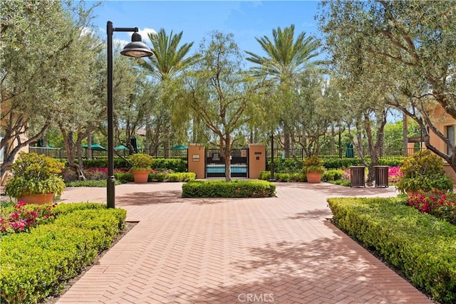 view of community featuring fence