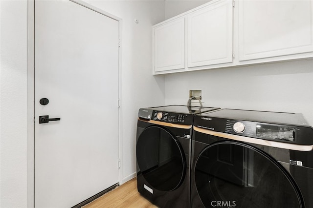 3116 Windhaven Way, Corona, CA 92882 - laundry room featuring separate washer and dryer, cabinet space, light wood finished floors, and baseboards