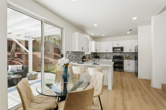 3116 Windhaven Way, Corona, CA 92882 - dining space featuring light wood-type flooring and recessed lighting