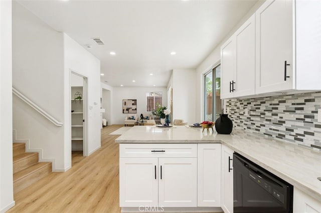 3116 Windhaven Way, Corona, CA 92882 - kitchen with black dishwasher, a peninsula, backsplash, white cabinets, and light wood finished floors