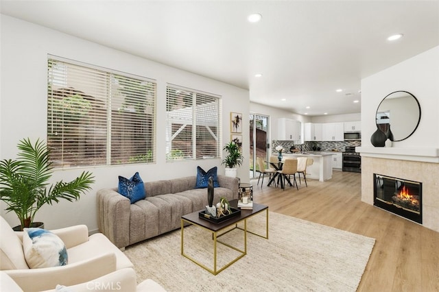 3116 Windhaven Way, Corona, CA 92882 - living area with light wood finished floors, recessed lighting, and a fireplace