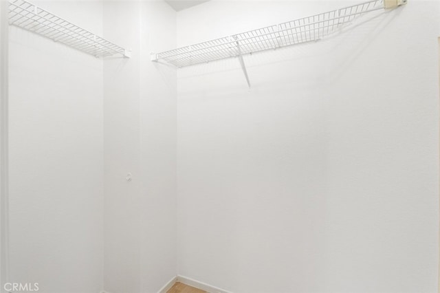 3116 Windhaven Way, Corona, CA 92882 - walk in closet featuring light wood finished floors
