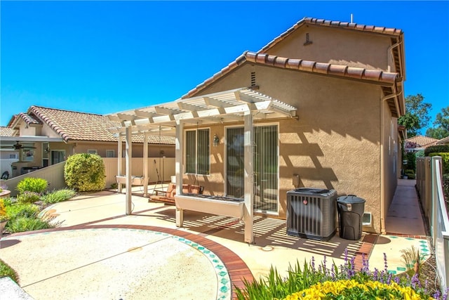 588 Twin Hills Dr, Banning, CA 92220 - back of property with a pergola, a patio, central air condition unit, stucco siding, and a tiled roof