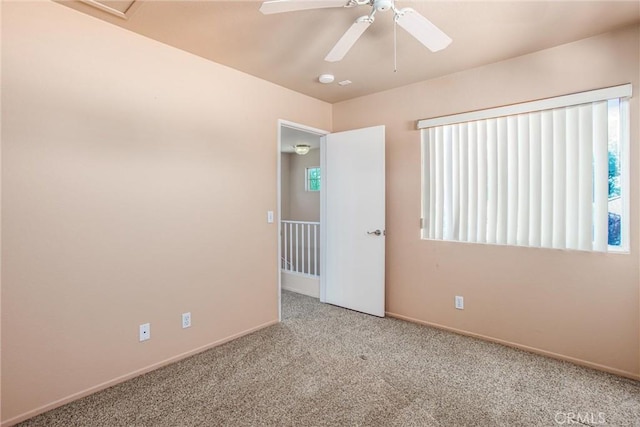 588 Twin Hills Dr, Banning, CA 92220 - carpeted empty room with baseboards, healthy amount of natural light, and ceiling fan