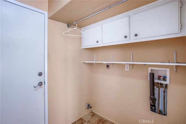 588 Twin Hills Dr, Banning, CA 92220 - laundry area with electric dryer hookup, hookup for a washing machine, baseboards, and cabinet space