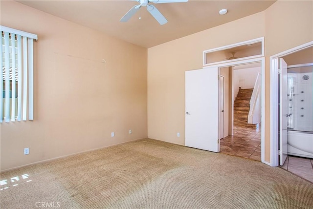 588 Twin Hills Dr, Banning, CA 92220 - unfurnished bedroom featuring carpet flooring and a ceiling fan