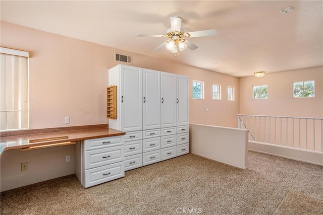588 Twin Hills Dr, Banning, CA 92220 - unfurnished office with built in study area, light carpet, and ceiling fan