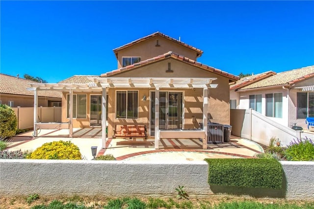588 Twin Hills Dr, Banning, CA 92220 - rear view of property with a pergola, a patio, stucco siding, and a tile roof