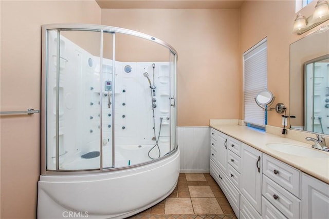 588 Twin Hills Dr, Banning, CA 92220 - full bath featuring an enclosed shower, vanity, and a wainscoted wall