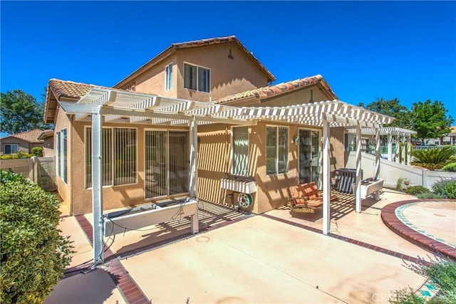 588 Twin Hills Dr, Banning, CA 92220 - back of property featuring a pergola, stucco siding, a patio area, and a tile roof