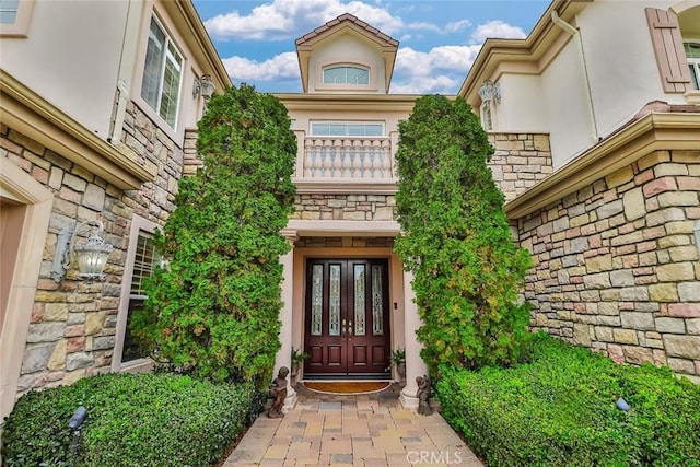 6791 Trevino Dr, Moorpark, CA 93021 - view of exterior entry featuring stone siding and stucco siding