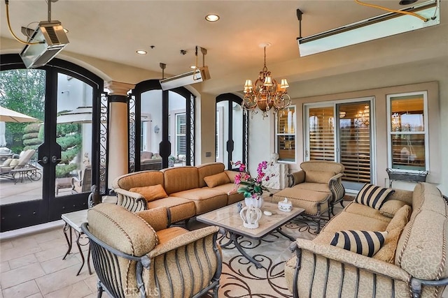 6791 Trevino Dr, Moorpark, CA 93021 - living area featuring arched walkways, recessed lighting, a chandelier, and french doors