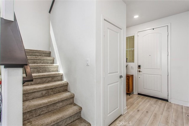 2335 Powell Dr, Rialto, CA 92377 - staircase featuring wood finished floors and recessed lighting