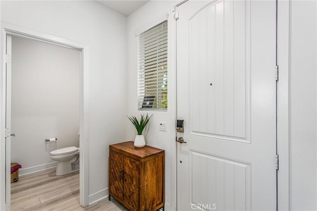 2335 Powell Dr, Rialto, CA 92377 - doorway featuring baseboards and light wood finished floors