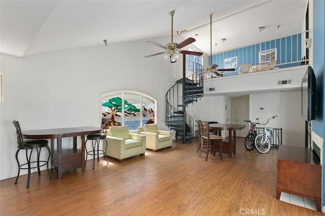 1100 Euclid Ave Unit 108, Long Beach, CA 90804 - living room with high vaulted ceiling, stairs, wood finished floors, and a ceiling fan