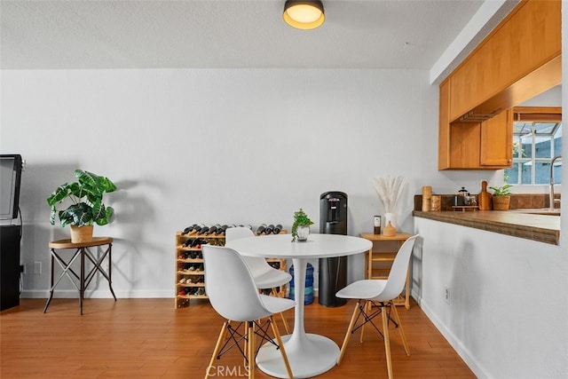 1100 Euclid Ave Unit 108, Long Beach, CA 90804 - dining space with baseboards and wood finished floors