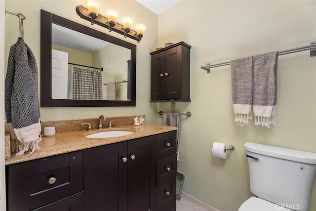 1100 Euclid Ave Unit 108, Long Beach, CA 90804 - bathroom featuring toilet, vanity, and baseboards