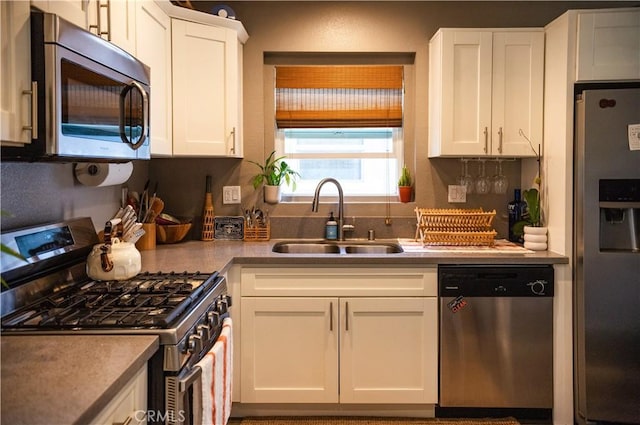 3100 Verdugo Rd, Los Angeles, CA 90065 - kitchen with stainless steel appliances, a sink, white cabinets, and light countertops