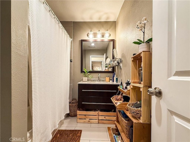 3100 Verdugo Rd, Los Angeles, CA 90065 - full bathroom featuring a textured wall, vanity, tile patterned flooring, and a shower with shower curtain