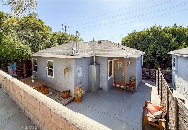 3100 Verdugo Rd, Los Angeles, CA 90065 - view of front of house with stucco siding, a patio, and roof with shingles