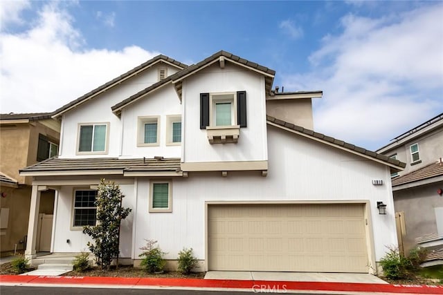 1810 Park Place Ln, Riverside, CA 92501 - view of front facade featuring a garage and a tile roof