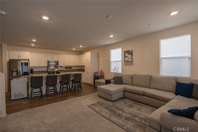 1810 Park Place Ln, Riverside, CA 92501 - living area with recessed lighting, dark wood finished floors, and dark colored carpet