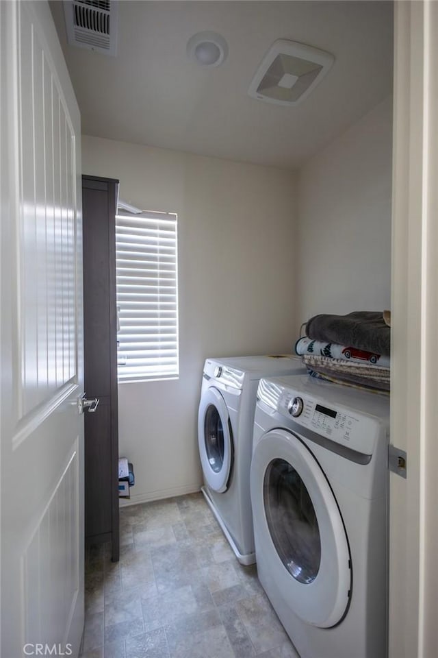 1810 Park Place Ln, Riverside, CA 92501 - laundry area with washer and dryer and baseboards