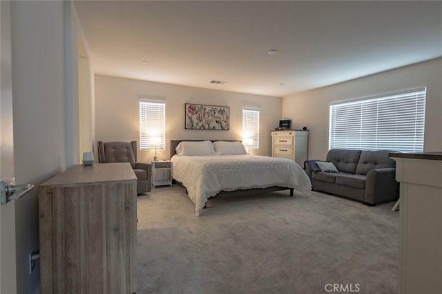 1810 Park Place Ln, Riverside, CA 92501 - bedroom featuring light carpet and multiple windows
