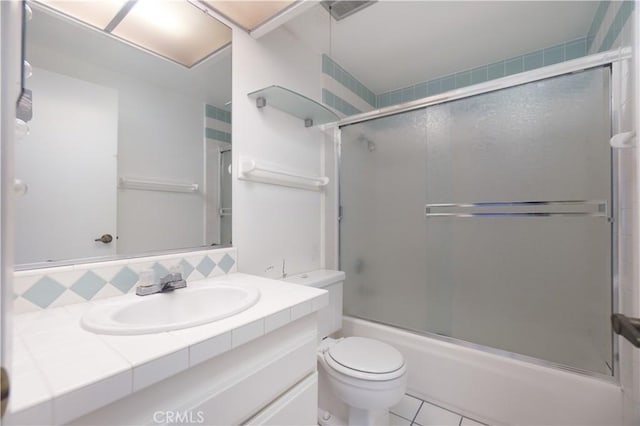 6523 E Camino Unit 2, Anaheim, CA 92807 - bathroom with toilet, vanity, bath / shower combo with glass door, tasteful backsplash, and tile patterned flooring