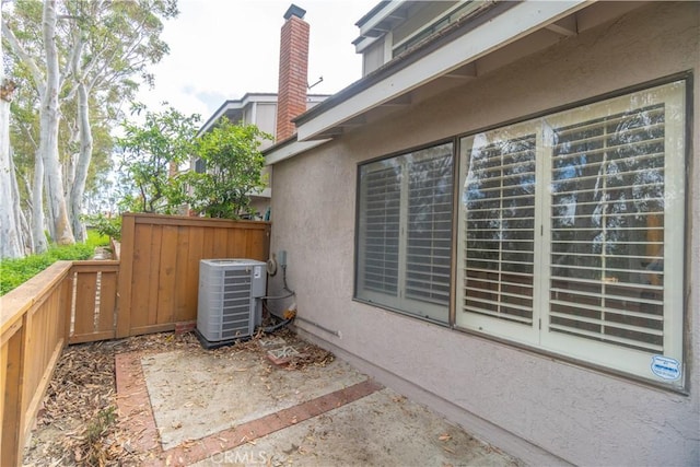 6523 E Camino Unit 2, Anaheim, CA 92807 - view of patio / terrace with central air condition unit and fence