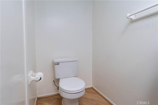 6523 E Camino Unit 2, Anaheim, CA 92807 - bathroom featuring baseboards, wood finished floors, and toilet