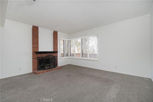 6523 E Camino Unit 2, Anaheim, CA 92807 - unfurnished living room with carpet flooring, a brick fireplace, crown molding, and a textured ceiling