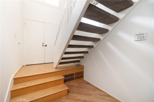 6523 E Camino Unit 2, Anaheim, CA 92807 - staircase with wood finished floors and baseboards