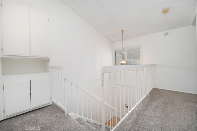 6523 E Camino Unit 2, Anaheim, CA 92807 - hall featuring an upstairs landing and carpet