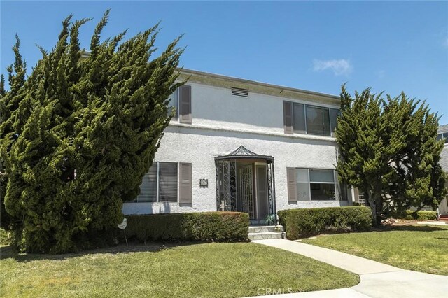 267 La Verne Ave, Long Beach, CA 90803 - view of front of home with stucco siding and a front yard