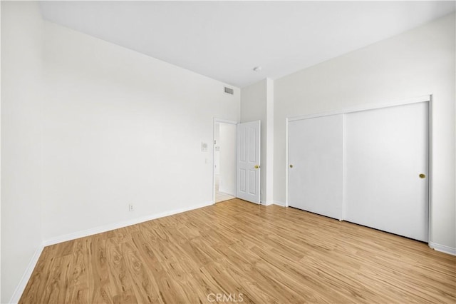 18560 Stonegate Ln, Rowland Heights, CA 91748 - unfurnished bedroom with light wood-style floors, baseboards, and a closet