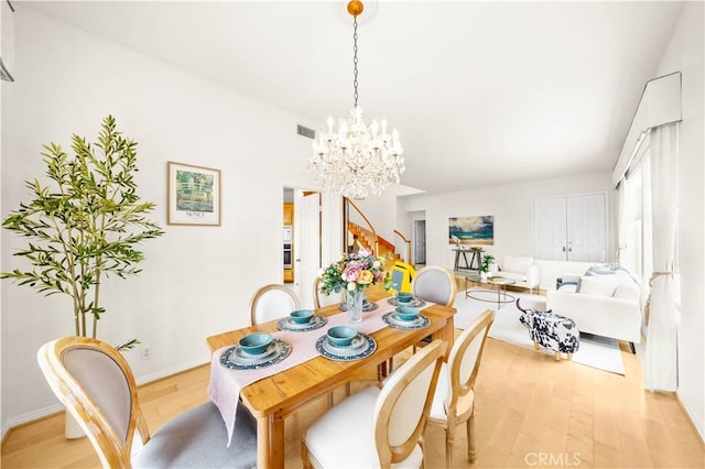 18560 Stonegate Ln, Rowland Heights, CA 91748 - dining room with stairway, light wood-style floors, a chandelier, and baseboards