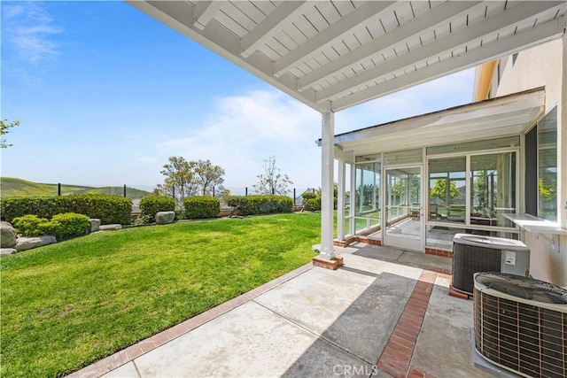 18560 Stonegate Ln, Rowland Heights, CA 91748 - view of grassy yard with a sunroom, central air condition unit, and a patio