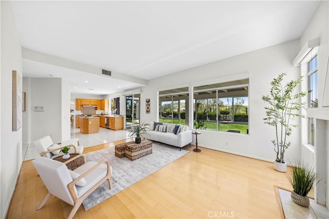 18560 Stonegate Ln, Rowland Heights, CA 91748 - living area featuring healthy amount of natural light, light wood-style floors, baseboards, and recessed lighting