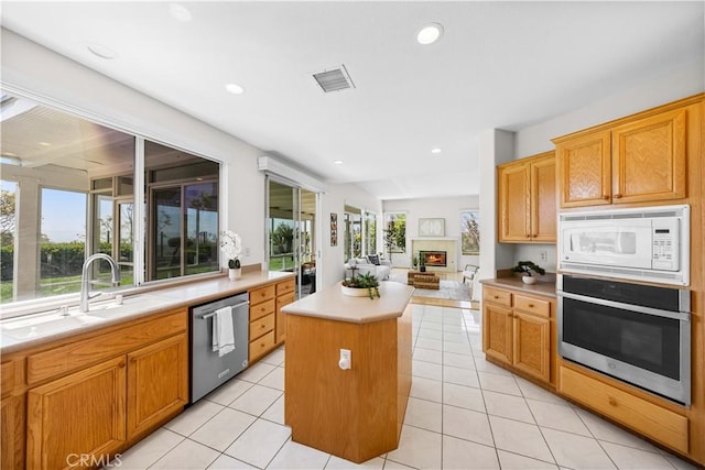 18560 Stonegate Ln, Rowland Heights, CA 91748 - kitchen featuring stainless steel appliances, a center island, a sink, plenty of natural light, and recessed lighting