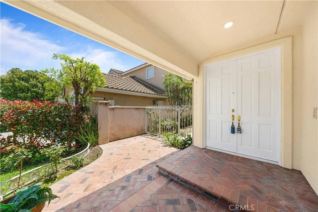 18560 Stonegate Ln, Rowland Heights, CA 91748 - doorway to property featuring stucco siding, fence, and a patio area