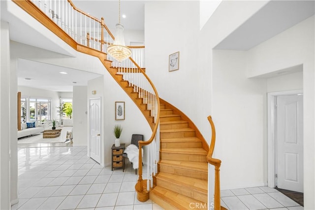 18560 Stonegate Ln, Rowland Heights, CA 91748 - stairway featuring a towering ceiling, tile patterned flooring, baseboards, and recessed lighting