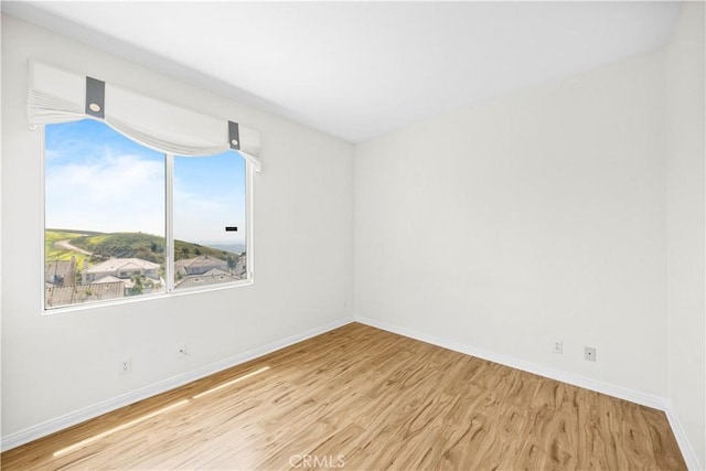 18560 Stonegate Ln, Rowland Heights, CA 91748 - spare room featuring wood finished floors and baseboards