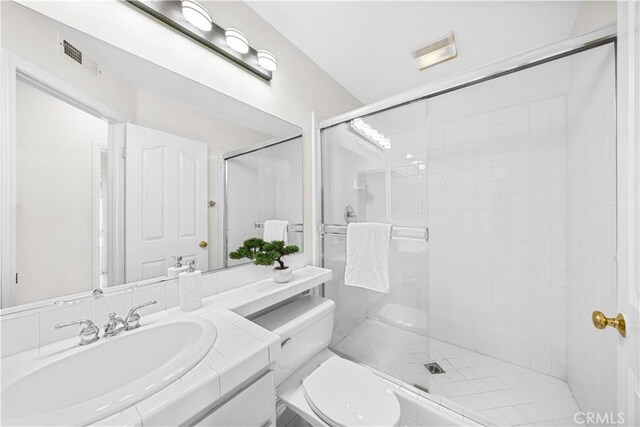 18560 Stonegate Ln, Rowland Heights, CA 91748 - bathroom featuring a stall shower, toilet, and vanity