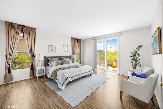 18560 Stonegate Ln, Rowland Heights, CA 91748 - bedroom featuring access to outside, light wood-type flooring, and multiple windows