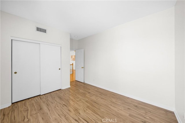 18560 Stonegate Ln, Rowland Heights, CA 91748 - unfurnished bedroom featuring light wood-style flooring, a closet, and baseboards