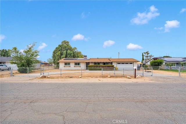 21046 Lone Eagle Rd, Apple Valley, CA 92308 - single story home featuring a gate, an attached garage, solar panels, concrete driveway, and a fenced front yard
