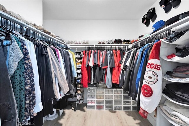 21046 Lone Eagle Rd, Apple Valley, CA 92308 - walk in closet with wood finished floors