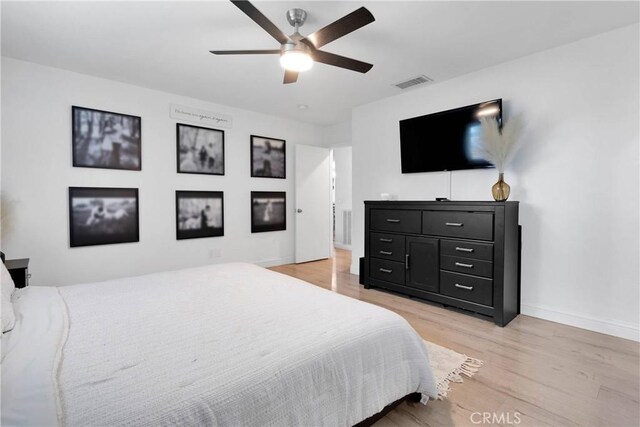 21046 Lone Eagle Rd, Apple Valley, CA 92308 - bedroom with light wood-style floors, baseboards, and a ceiling fan