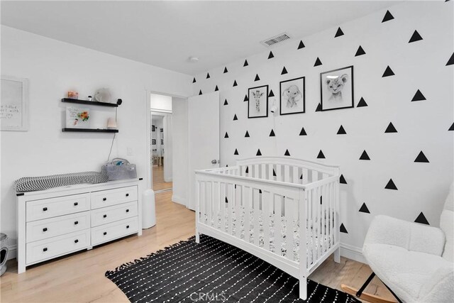 21046 Lone Eagle Rd, Apple Valley, CA 92308 - bedroom with light wood-style flooring